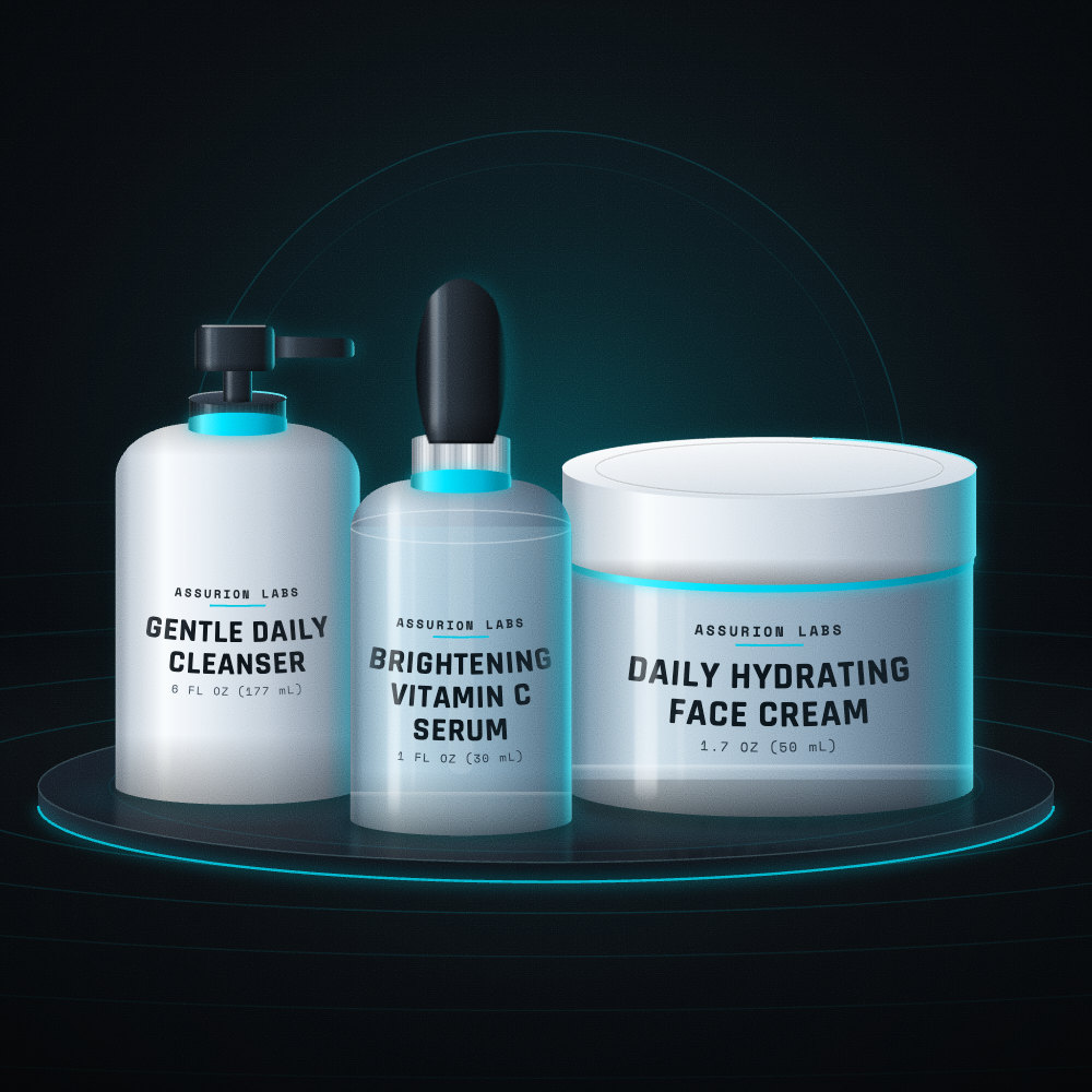 Assurion Labs Brightening Routine set with a cleanser, a vitamin C dropper serum, and a face cream on a dark background
