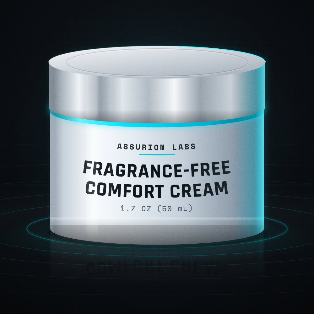 Frosted glass jar of Assurion Labs Fragrance-Free Comfort Cream on a dark background