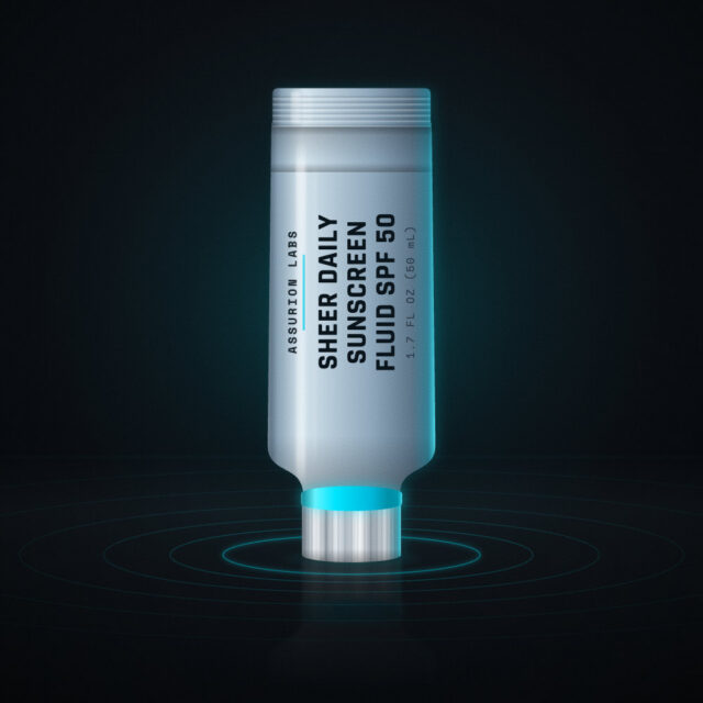 Slim frosted tube of Assurion Labs Sheer Daily Sunscreen Fluid SPF 50 on a dark background