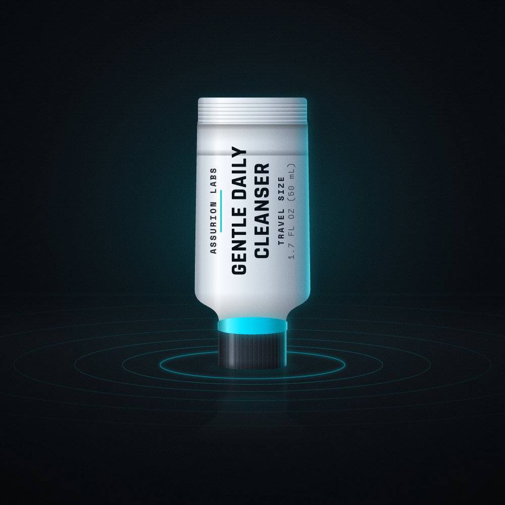 Mini frosted tube of Assurion Labs Travel Size Gentle Daily Cleanser on a dark background